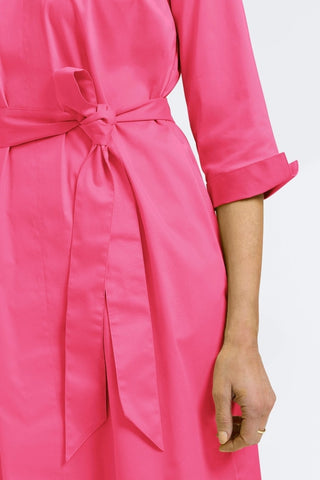 Close up of the rolled cuffs on the Agnes Stretch Matte Sateen 3/4 Sleeve Dress
 and it's self tied belt #color_pink flambe