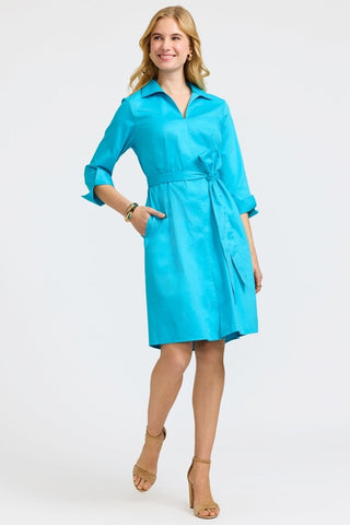 Front view of the Agnes Stretch Matte Sateen 3/4 Sleeve Dress worn with the belt and the models hand in the functioning pocket #color_ibiza turq
