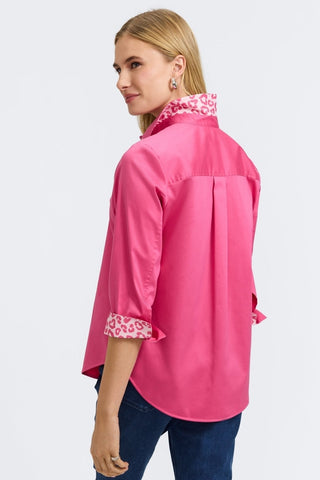 Angled back view of the Margie Stretch Matte Sateen 3/4 Sleeve Shirt with the cuffs folded and collar flared up to show the print #color_pink flambe 