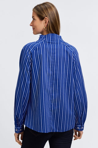 Back view of model wearing the Daphne Classic Wide Stripe Long Sleeve Popover Shirt #color_blue & white wide stripe