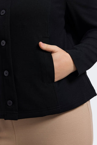Close up of the functioning pockets featured in the Valerie Plus Knit Crepe Long Sleeve Jacket #color_black