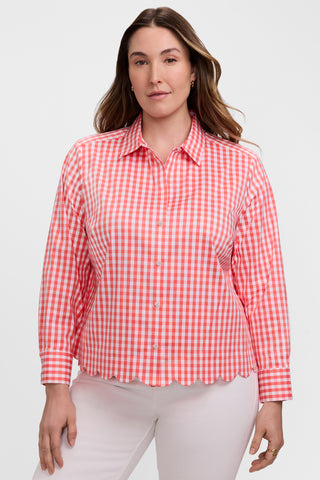 Front view of model wearing the Scarlett Plus Gingham Stretch Matte Sateen Long Sleeve Shirt with a pair of white pants #color_georgia peach/white gingham