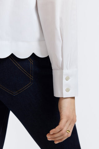 Close up of one of the sleeves of the Scarlett Stretch Matte Sateen Long Sleeve Shirt showing the signature triple pleating on the cuffs #color_white