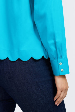 Focused view on the scalloped hem and triple pleated cuffs of the Scarlett Plus Stretch Matte Sateen Long Sleeve Shirt
#color_ibiza turq