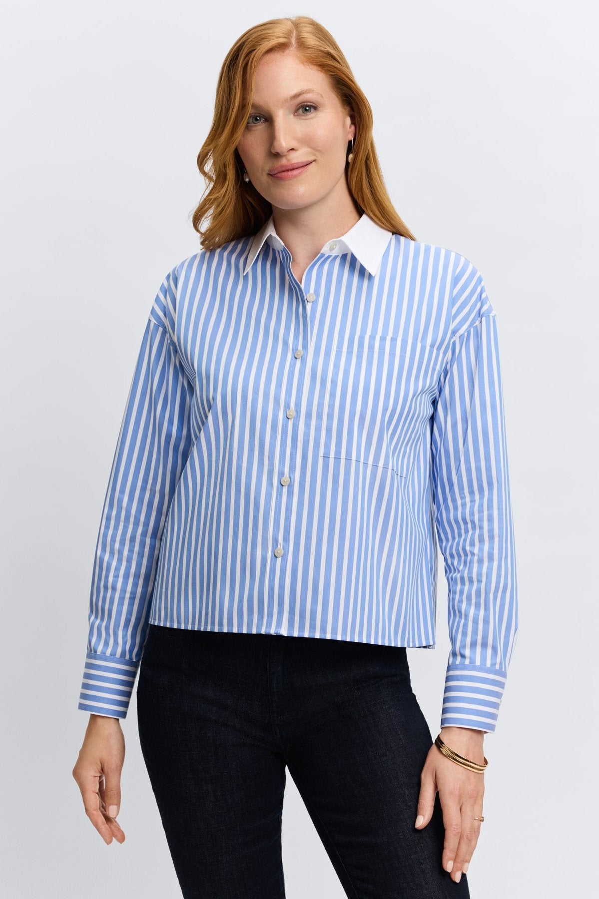Light blue Foxcroft striped shirt, crafted from no-iron fabric for functionality and refined fashion.