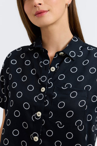Woman in Foxcroft Abigail short sleeve blouse with playful circle dot print, effortless style