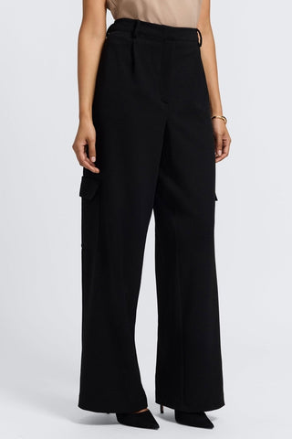 Angled front view of the sleek and tailored wide leg cargo pants #color_black