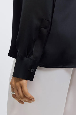 Buttoned cuff and sleeve of the Bianca beyond silk shirt #color_black