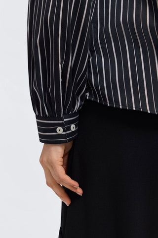 Close up of the button cuffs of the Daphne Classic Wide Stripe Long Sleeve Popover Shirt #color_black & white wide stripe