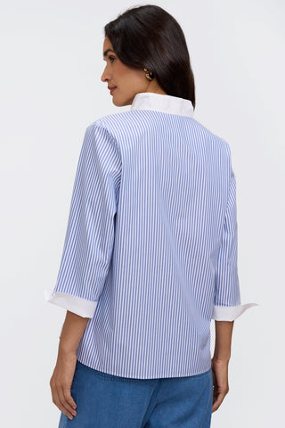 Back view of the 3/4 sleeve popover shirt worn untucked #color_powder blue pinpoint stripe