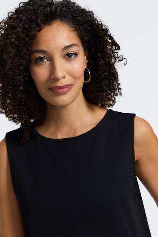 Close-up of the scoop neckline of the Callie reversible sleeveless tank in #color_black
