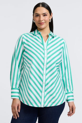 Plus-sized woman in a button down shirt with kelly green stripes, designed in a flattering fit that transitions from work to weekend.