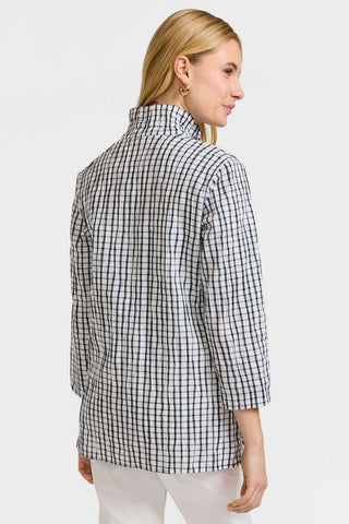 Angled back view of the model wearing the crinkle shirt jacket #color_White/Black