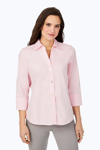 Woman in Foxcroft Paityn 3/4 sleeve shirt in #color_chambray pink