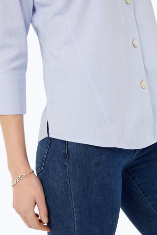 Close-up of the 3/4 sleeve on the Paityn shirt in #color_blue wave