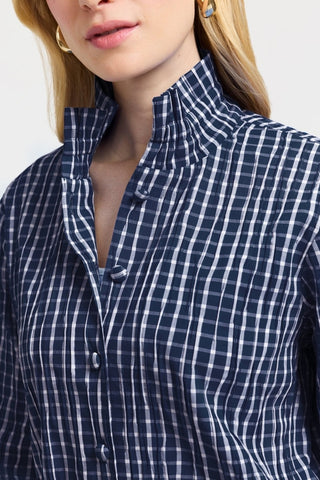 Close up of the ruffled neck and fabric covered buttons of the shirt #color_Navy/White