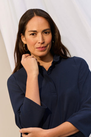 Waist up image of a woman wearing the Tammy Knit Crepe 3/4 Sleeve Popover Shirt #color_navy