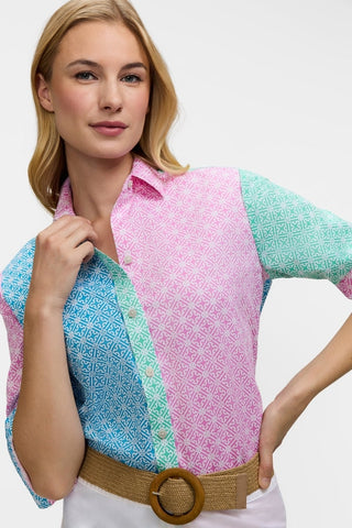 Close up front view of model wearing the Meghan Geo Lattice Colorblock Long Sleeve Shirt tucked in and sleeves rolled up to elbows