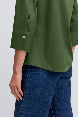 Angled side view of the Mary No Iron Stretch 3/4 Sleeve Shirt showing off the 3/4 length sleeves and the shell buttoned cuff #color_basil