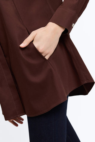 Angled side view of the Cici No Iron Pinpoint Long Sleeve Tunic with a woman's hand in the angle seamed pocket  #color_chicory coffee