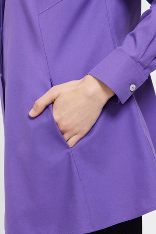 Close up of hand in the angle seamed pocket of the Cici No Iron Pinpoint Long Sleeve Tunic #color_royal purple