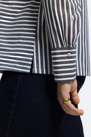Side view of the triple-pleated cuffs giving the Bella Plus Striped Long Sleeve Shirt a polished and tailored feel #color_black/white