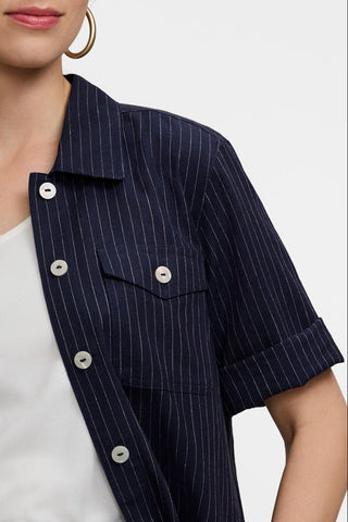Close up of the pearlized buttons and the chest pocket featured on the Estela Pinstripe Linen Short Sleeve Jacket