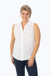Plus-size woman wearing a Taylor Plus Essential Stretch Non-Iron Sleeveless Shirt by Foxcroft, styled with sleeveless design for modern wrinkle-free fashion.