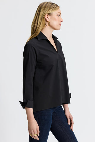 Foxcroft Agnes black no-iron shirt styled on a woman with classic fit and versatile appeal. #color_black