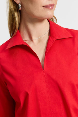 Wing collar and v-neckline of the Agnes long sleeve shirt #color_simply red