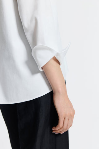 Close-up of the sleeves and flip back cuffs of the Agnes popover shirt #color_white