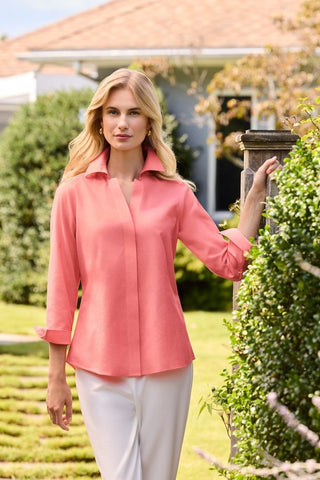 Taylor no iron pinpoint 3/4 sleeve shirt worn by a woman outside #color_coral reef