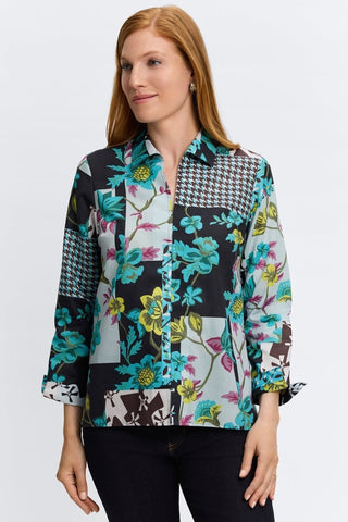 Woman wearing Foxcroft teal multi-print blouse with flattering fit