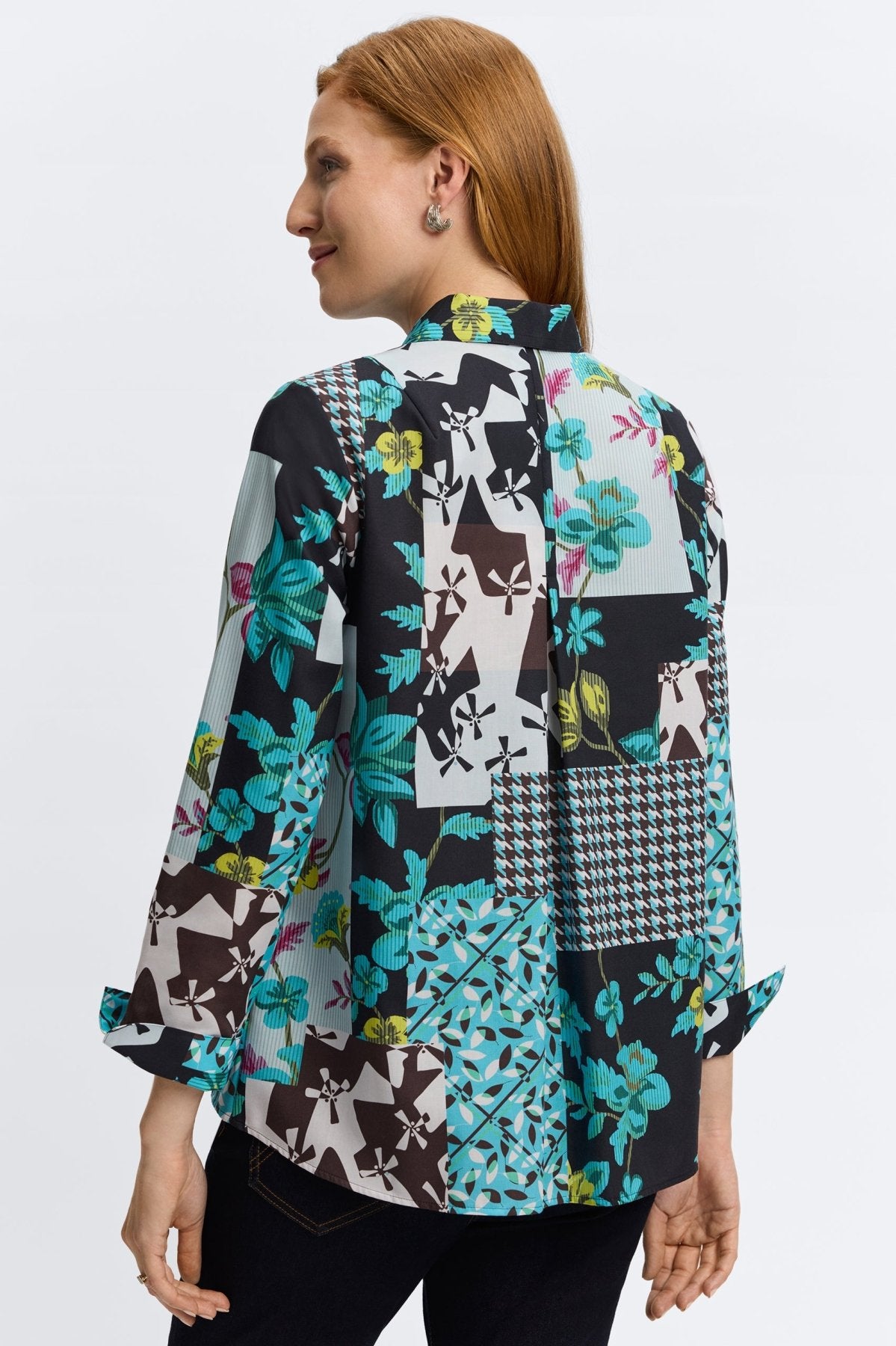 Woman wearing Foxcroft teal multi-print blouse with flattering fit