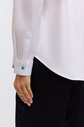 Colorful button on the cuff of the Charlie long sleeve button down shirt