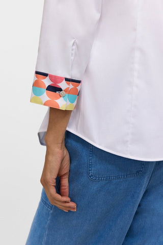 View of the 3/4 sleeves and it's fun pattern featured on the Luna Retro Dot Shirt