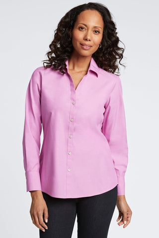 Woman in Foxcroft Mary shirt in rose quartz pink with a timeless, flattering fit