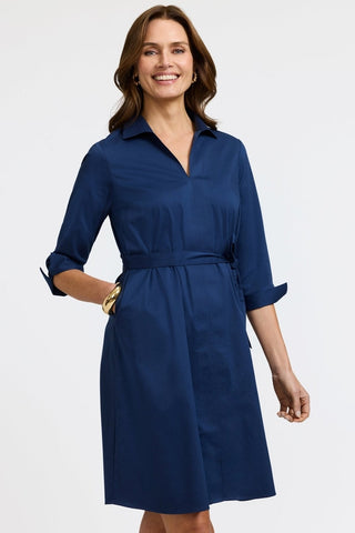 Front view of the Agnes Stretch Matte Sateen 3/4 Sleeve Dress with the models hand in the functioning pocket #color_navy