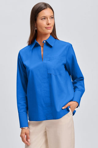 Front view of a woman wearing the Bella No Iron Stretch Long Sleeve Shirt with hand in pant pocket #color_cobalt blue