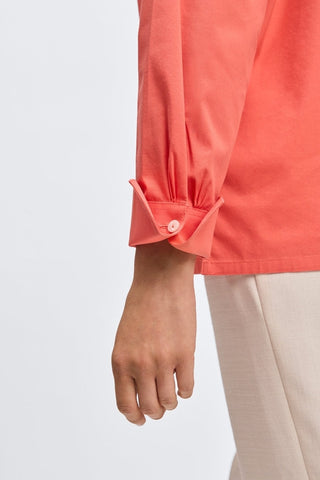 Close up view of the folded buttoned cuff of the Bella No Iron Stretch Long Sleeve Shirt #color_tangerine