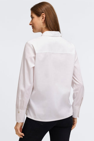 Back view of a woman wearing the Bella No Iron Stretch Long Sleeve Shirt
#color_white