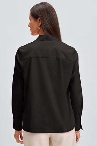 back view of a woman wearing the Bella No Iron Stretch Long Sleeve Shirt #color_black