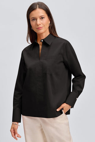 Front view of a woman wearing the Bella No Iron Stretch Long Sleeve Shirt #color_black