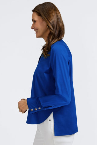 Side view of woman wearing Pearl Stretch Matte Sateen Long Sleeve Shirt
with bent arms #color_blue topaz
