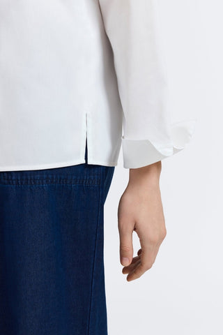 Close up view of the slit cuffs on the Tammy No Iron Stretch Long Sleeve Popover Shirt #color_white