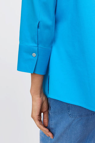 Zoomed in view of the 3/4 sleeve and shell buttoned cuff on the Mary No Iron Stretch 3/4 Sleeve Shirt #color_malibu blue