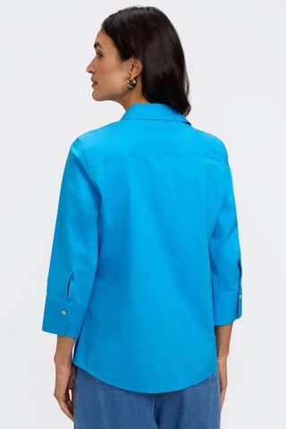 Back view of a woman wearing the Mary No Iron Stretch 3/4 Sleeve Shirt #color_malibu blue