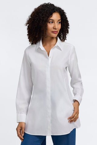 Front view of a woman wearing the Cici No Iron Pinpoint Long Sleeve Tunic with her thumb in the pocket #color_white
