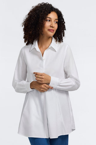Front view of a woman wearing the Cici No Iron Pinpoint Long Sleeve Tunic with her hands in front of her #color_white