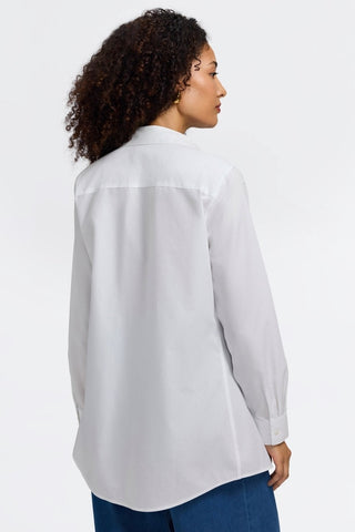 Back view of a woman wearing the Cici No Iron Pinpoint Long Sleeve Tunic #color_white